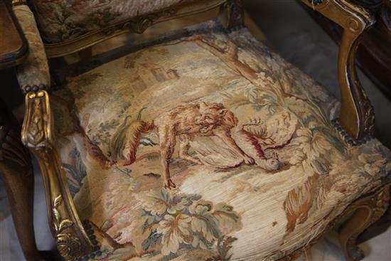 A Louis XV style floral carved three piece suite,